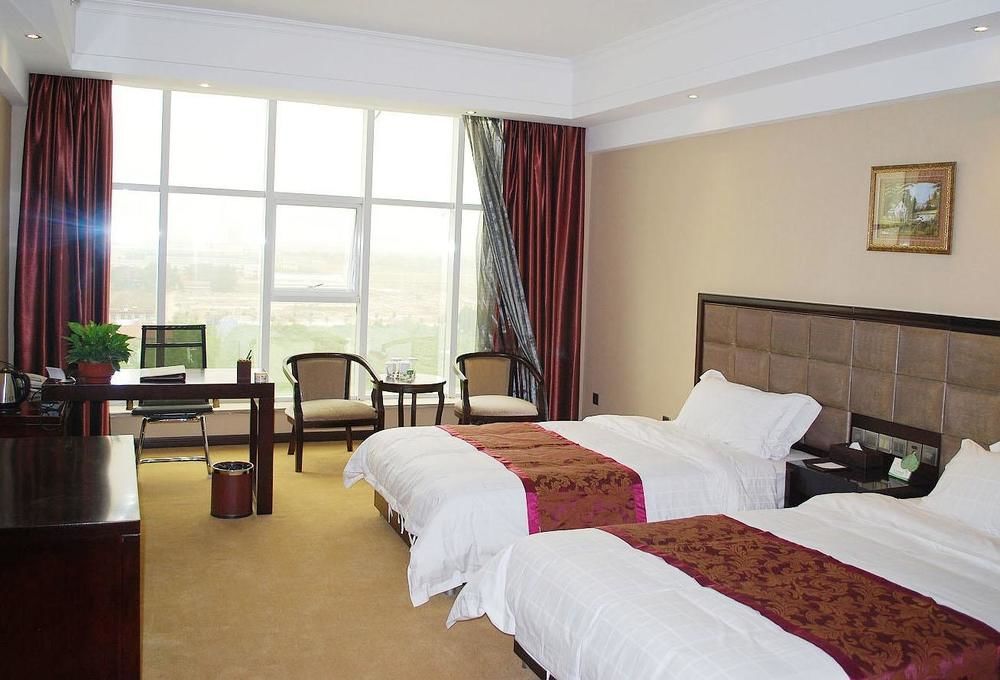 Weishi International Hotel Qing Zhou Екстериор снимка